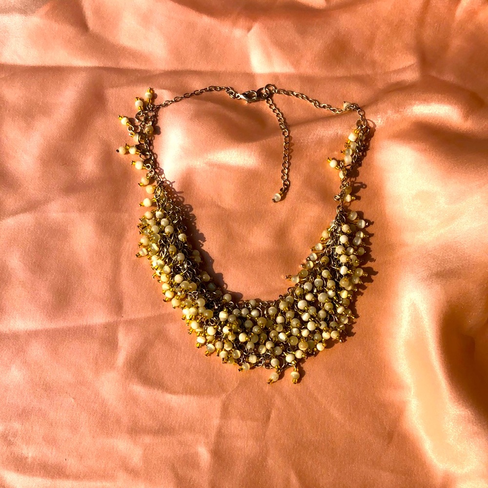 Gorgeous necklace with white and yellow beads.